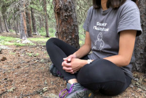woman in meditation in forest